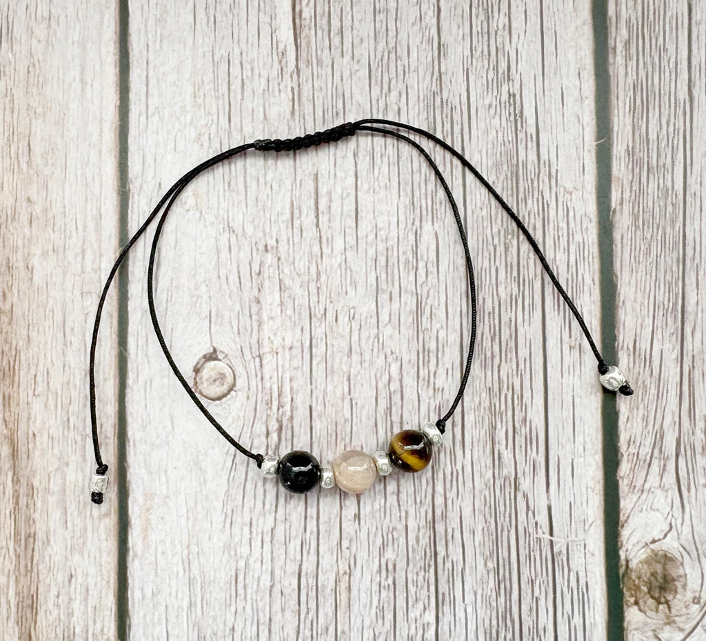 Necklace with beads on a wooden surface